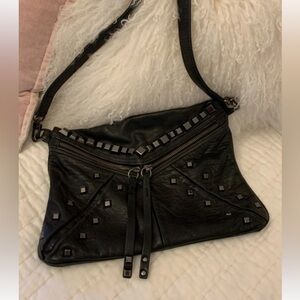 Treesje Jovi studded leather crossbody bag in black.
